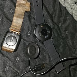 One Ken's and one women's Bluetooth smart watches